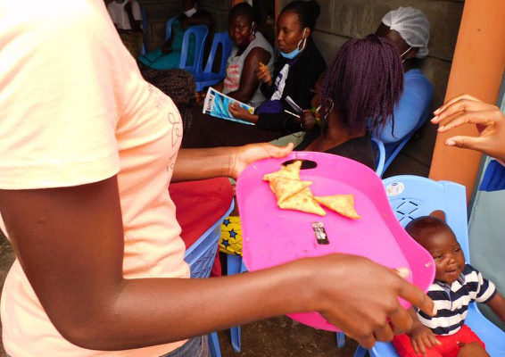 Holding tray of food in cooking class
