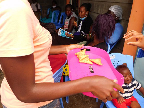 Holding tray of food in cooking class